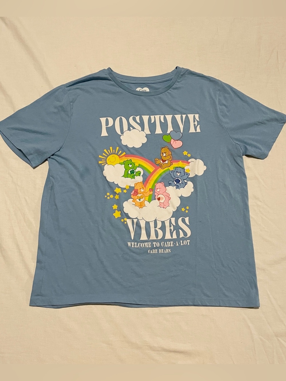 Care Bears Positive Vibes Welcome to Care-A-Lot Graphic T-Shirt Blue Medium